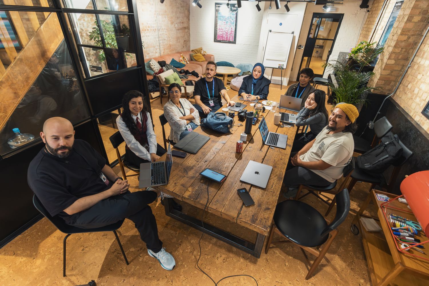 Founders collaborating around a table in a co-working space